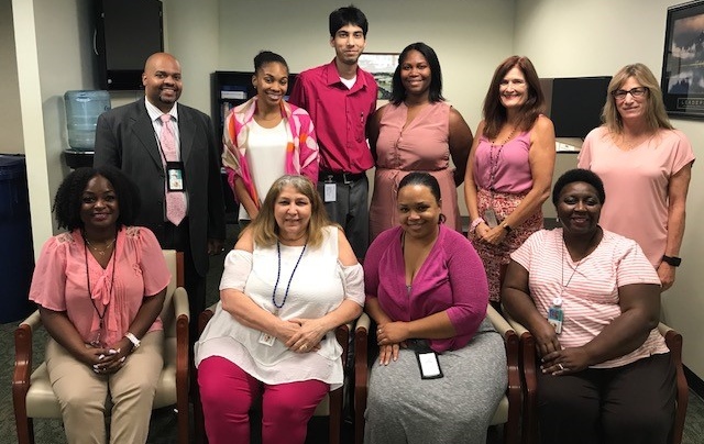 Ten DBS staff members from the state office wearing pink clothing in honor of Breast Cancer Awareness Month.